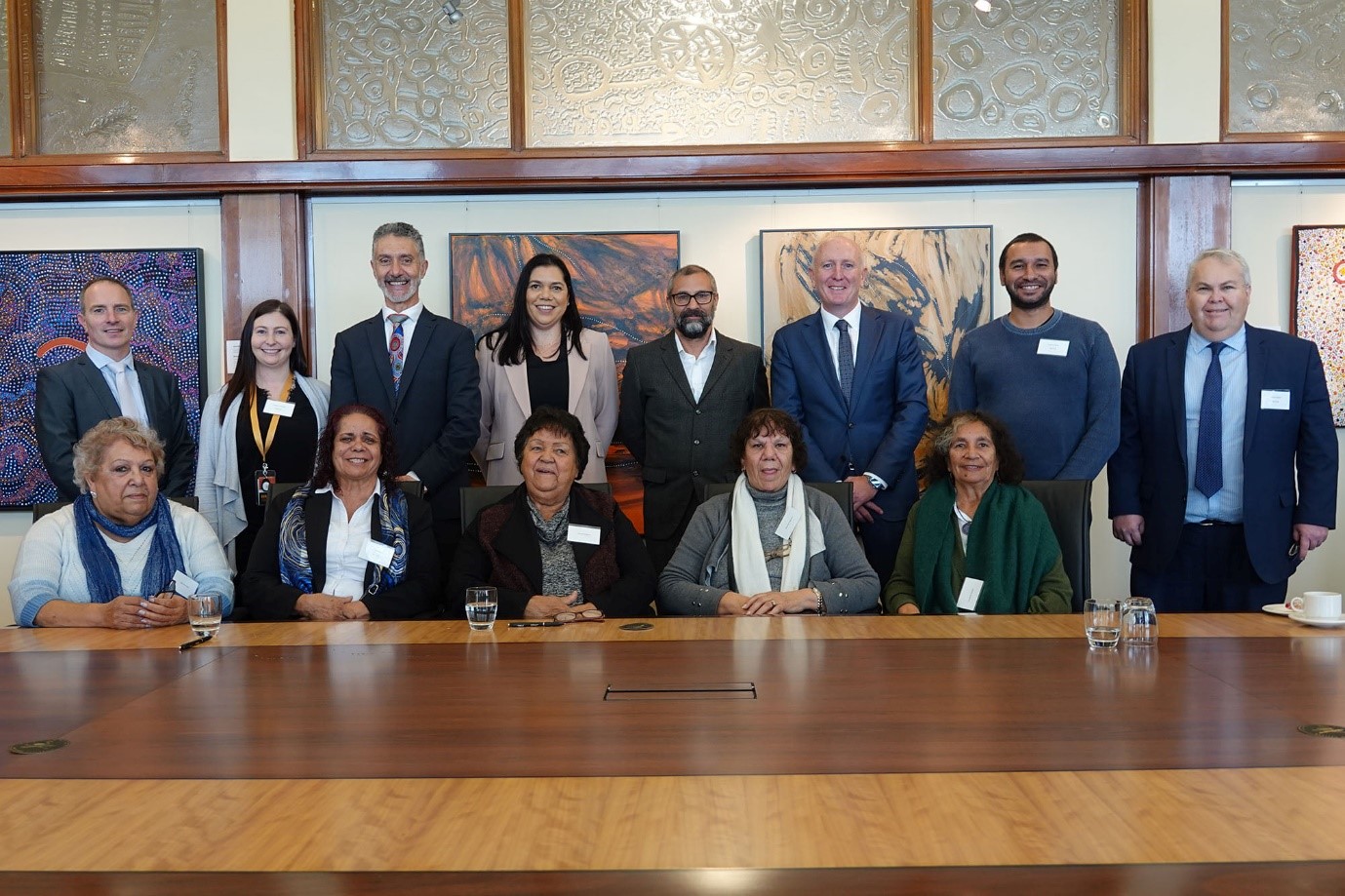 Photograph of Minister Dawson, Minister Buti, SWALSC Board and Executives and Noongar Elders at the signing ceremony in the Aboriginal Peoples Room at Parliament House