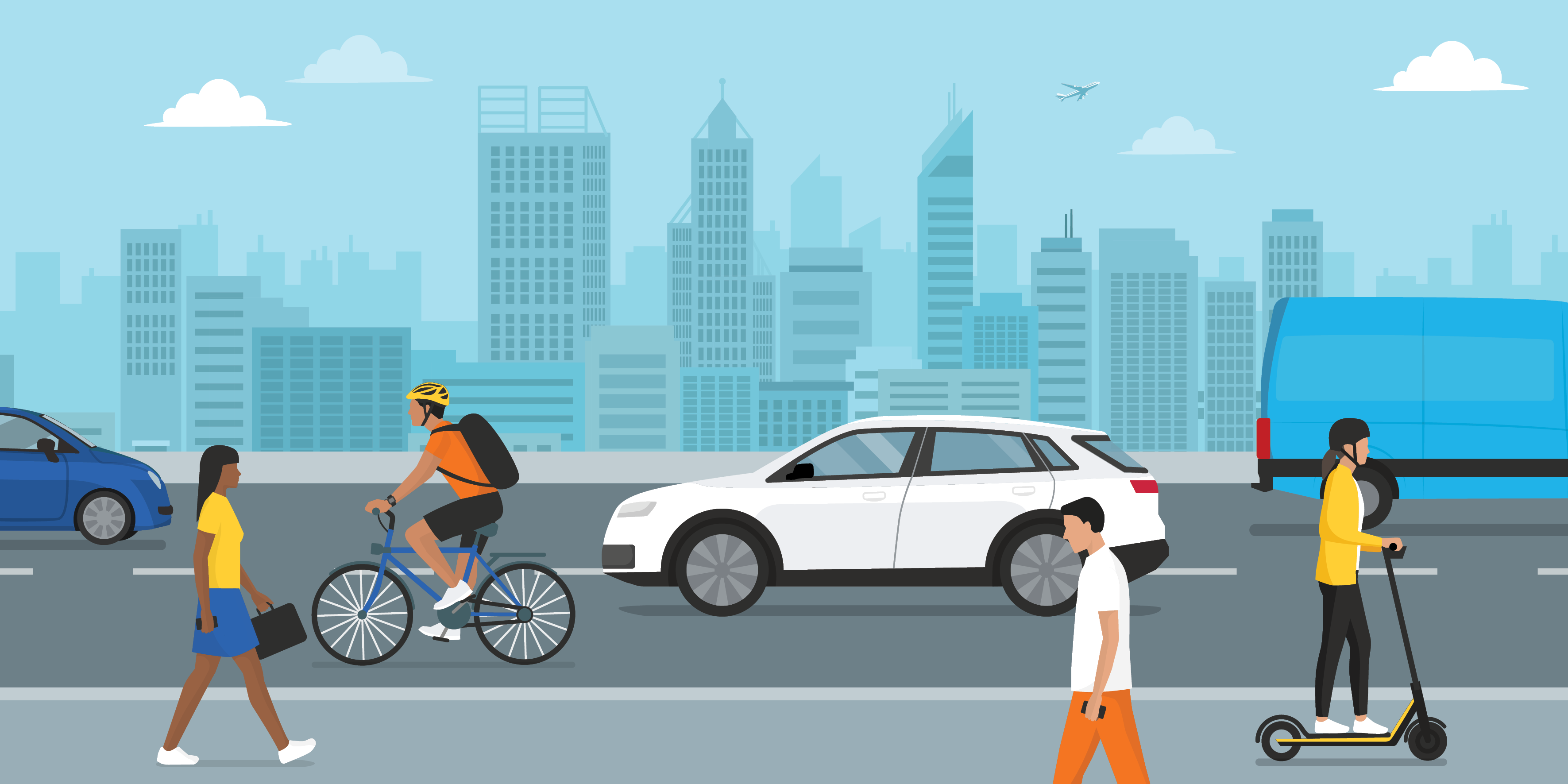 people walking down a street filled with cars and a cyclist, city buildings in background