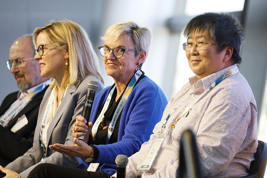 Four people fronting panel discussion 6
