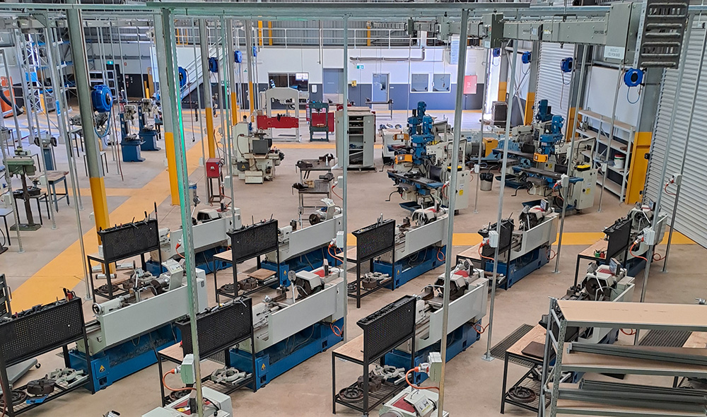 A view of Pundulmarra TAFE workshop with various machines and workstations.