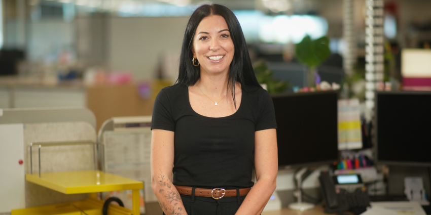 Jasmine - Youth Justice Officer standing in the office