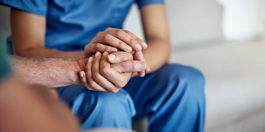 image of two people holding each others hands