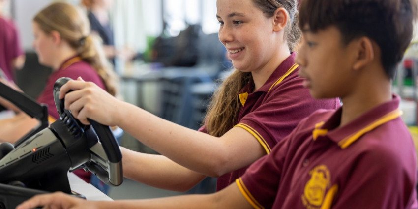 Two kids are engaging with the WA Road Safety Commission's interactive platform